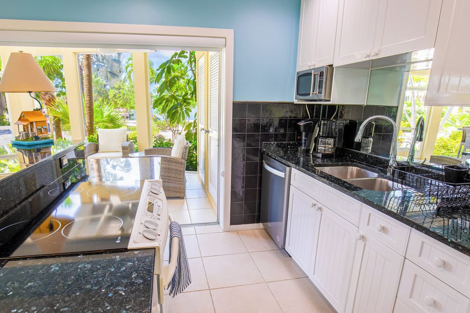 Full kitchen with modern appliances.