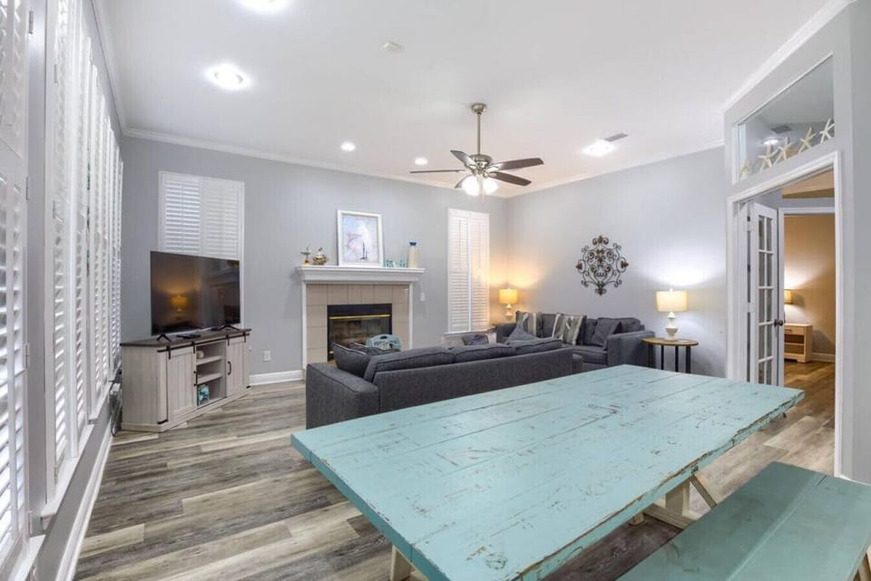 Enjoy meals around the dining table with cozy views of the fireside living room.