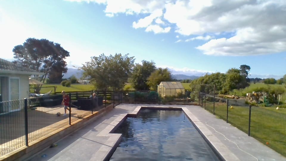 View beyond the pool to Tararua Ranges