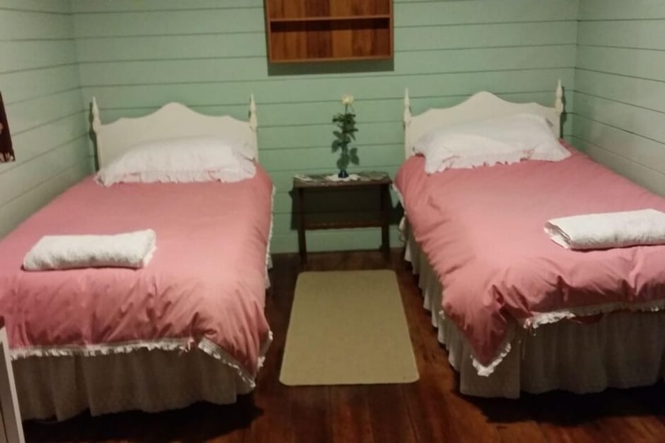 The bedroom in Te Whare