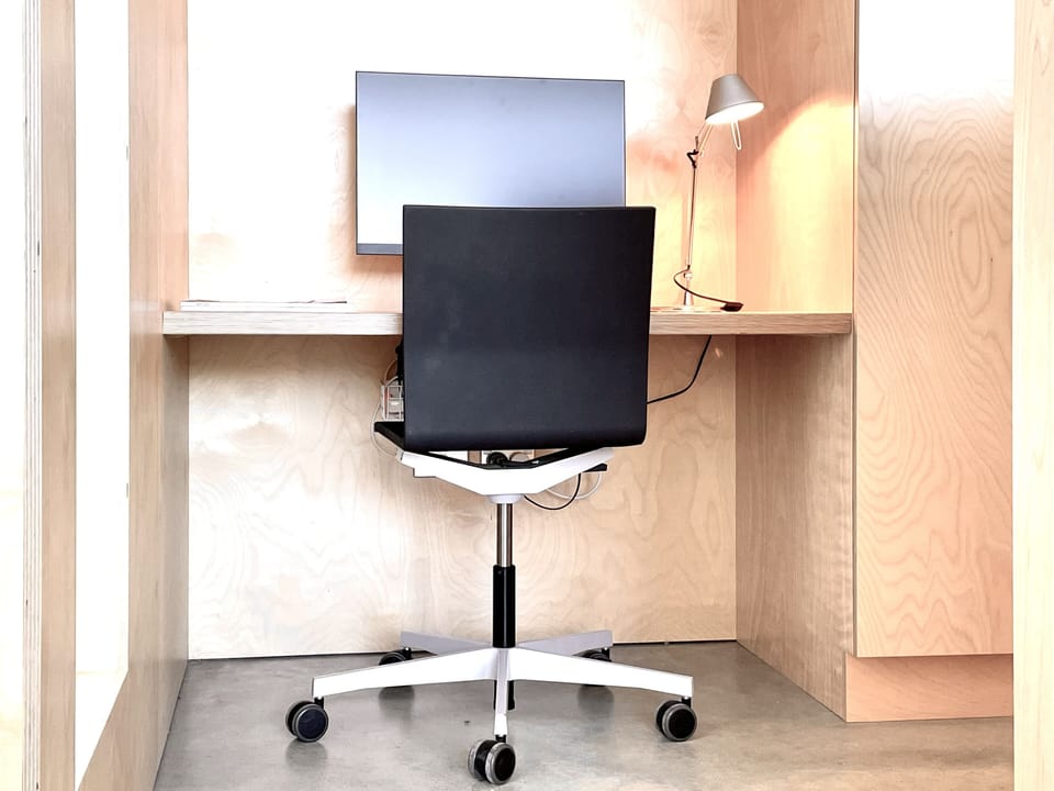 Work from home space with monitor discretely positioned in Master Bedroom