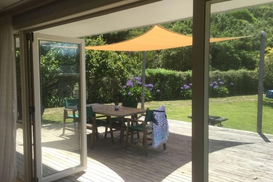A beautiful sunny day under the shade sail on the deck. 