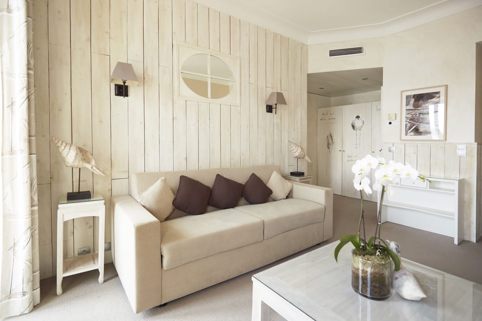 Suite, Sea View | Living area | Flat-screen TV