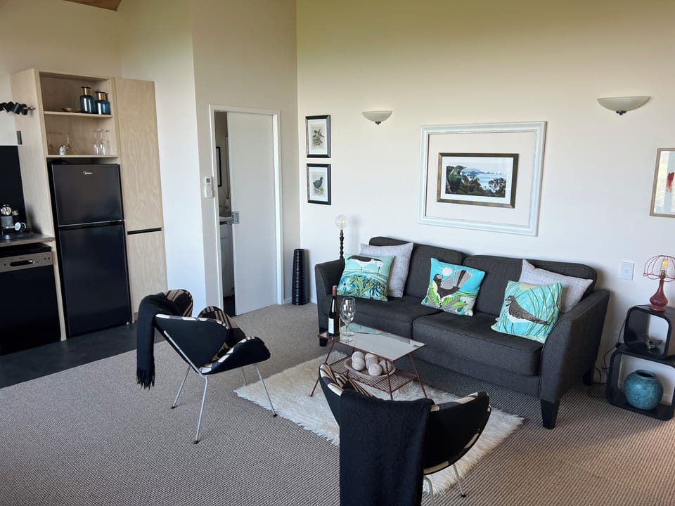 Living room showing through to kitchen and laundry (through sliding door)