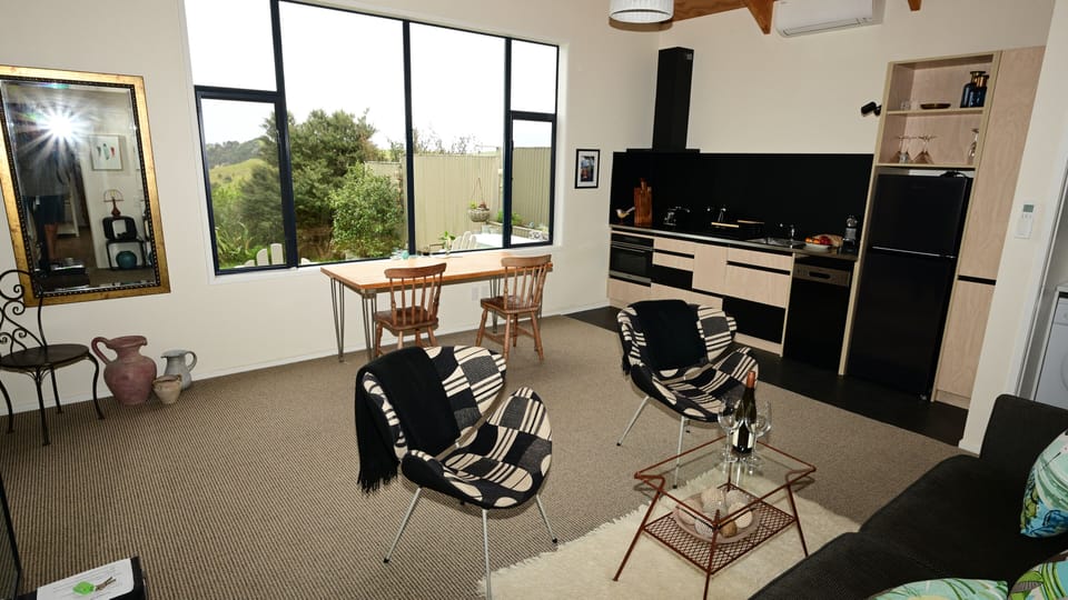 Living area towards dining and kitchen