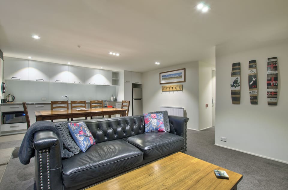 Open living area, lounge, dining and kitchen.