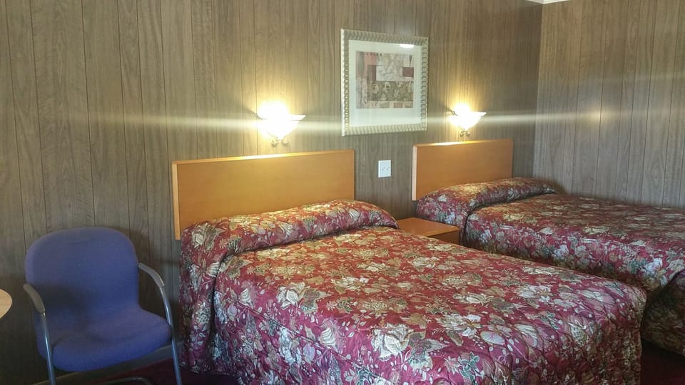 Basic Double Room, 2 Double Beds | Living area | 32-inch LED TV with digital channels, TV, streaming services