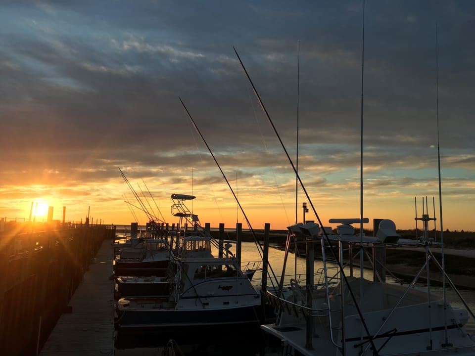 Beautiful sunsets at Rock Harbor in Orleans book your fishing charter here! 