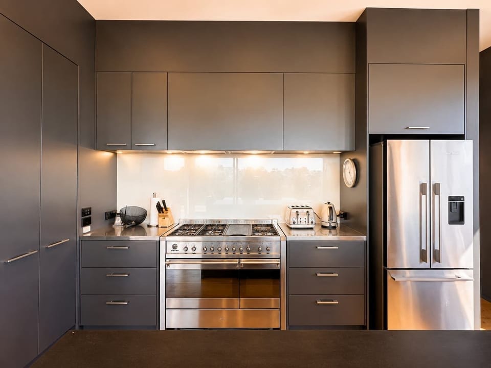 Modern kitchen with gas cooktop.