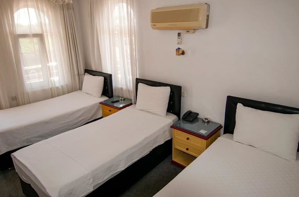 Standard Triple Room | Minibar, free WiFi, bed sheets