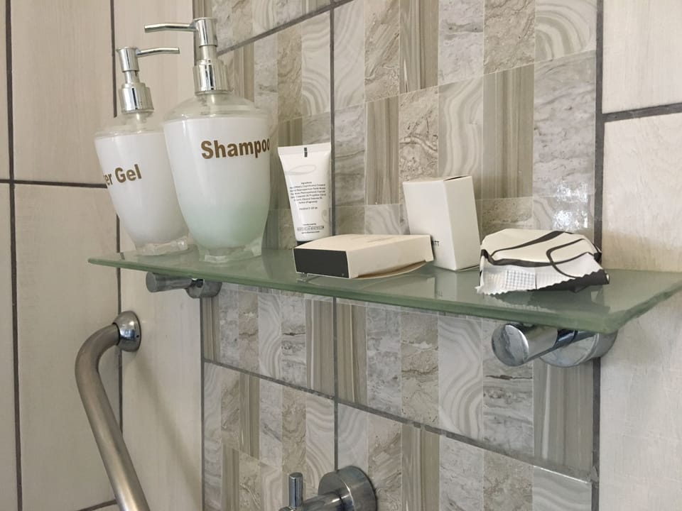 Standard Double Room | Bathroom amenities | Combined shower/tub, rainfall showerhead, designer toiletries, towels