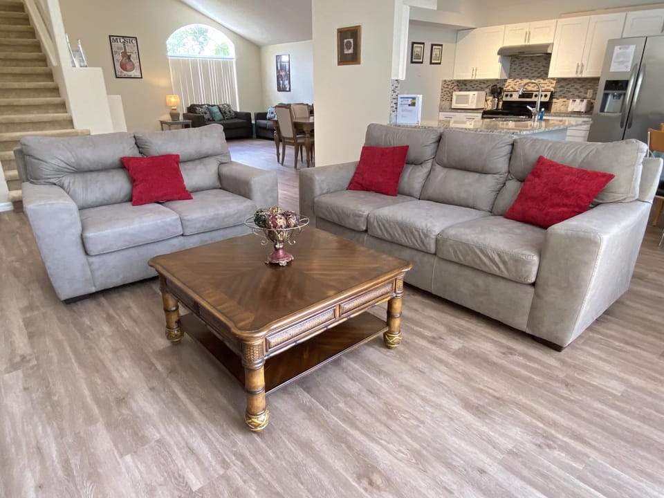 Spacious living area with comfortable couches, perfect for group gatherings and movie nights.