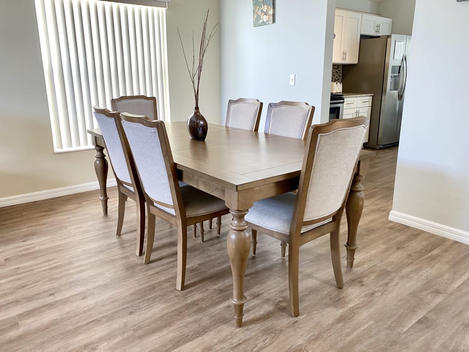 Elegant dining area with seating for six, ideal for family meals and gatherings.