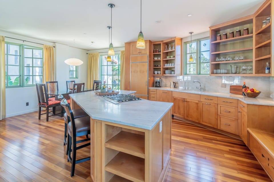 Casual bar seating at the kitchen island and a conversation nook tucked in too!