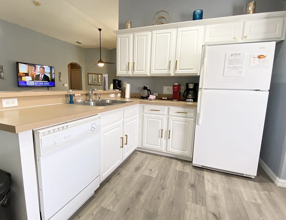 Spacious kitchen with plenty of counter space, ideal for preparing meals or enjoying a quick snack.