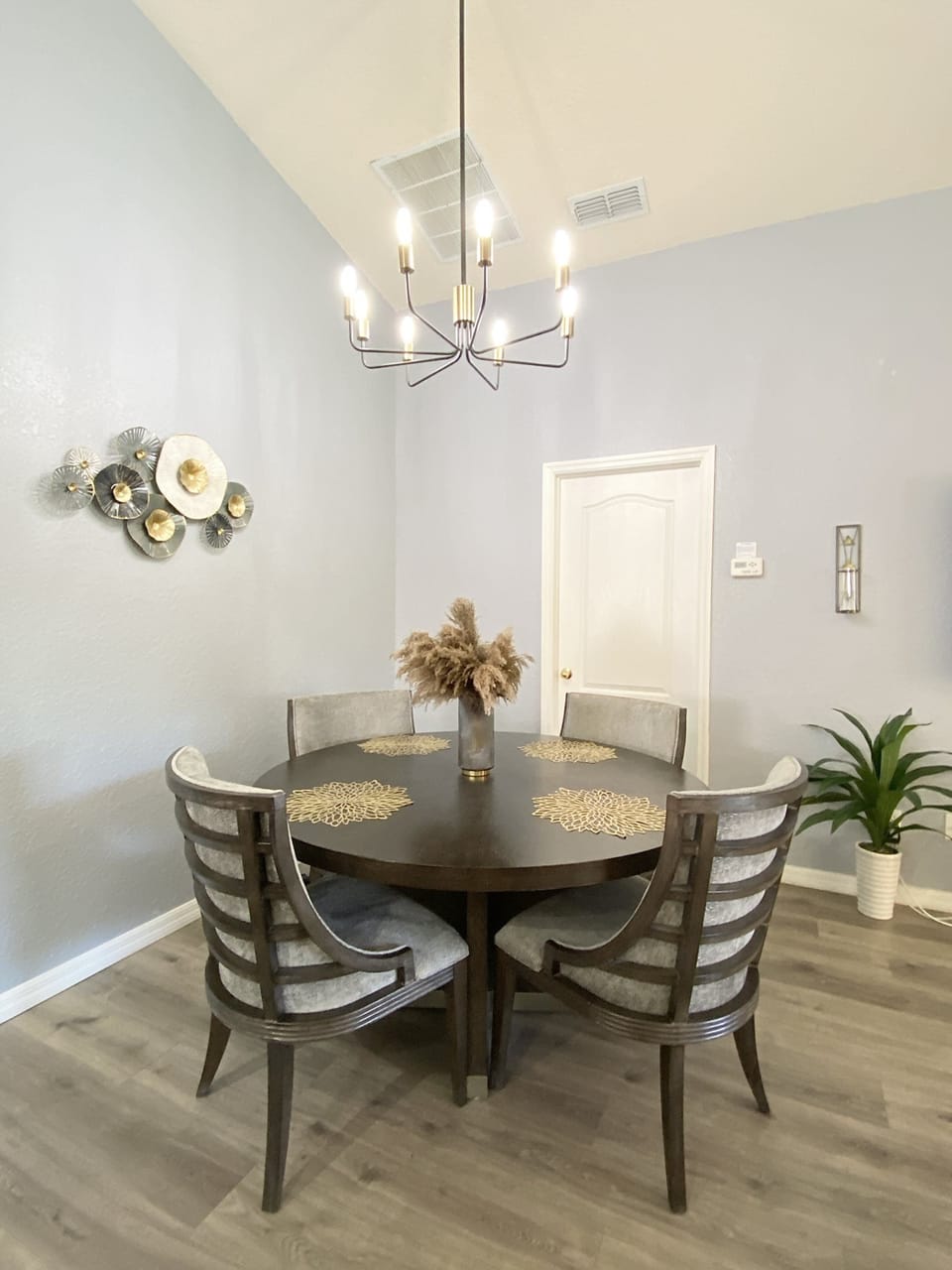 Elegant dining room with a beautiful chandelier, perfect for enjoying family dinners or special gath