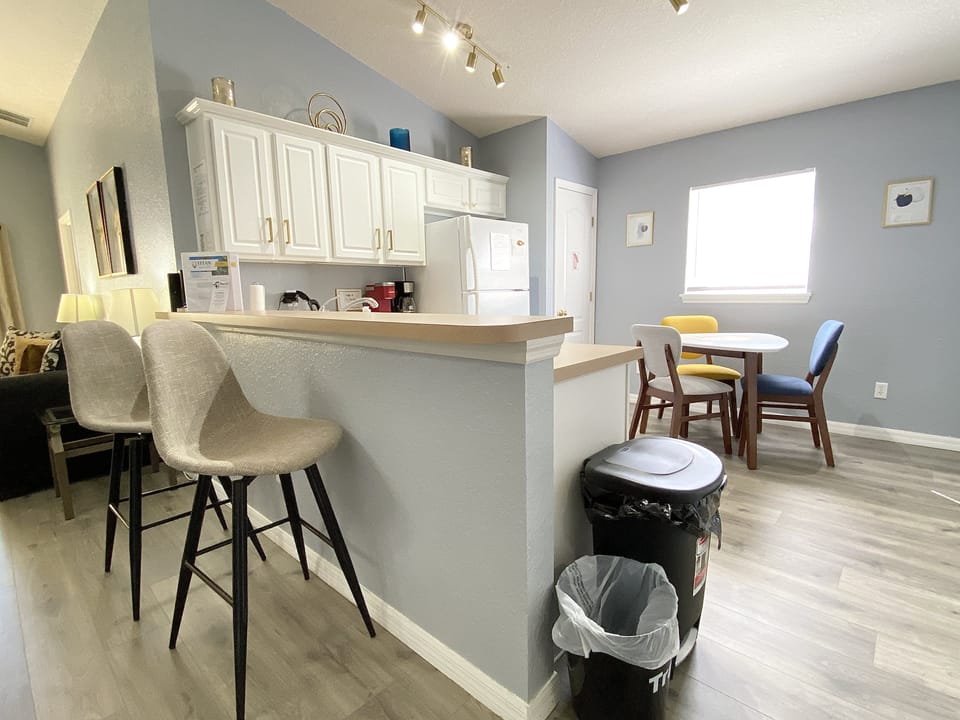 Fully equipped kitchen with ample seating, perfect for enjoying meals together.
