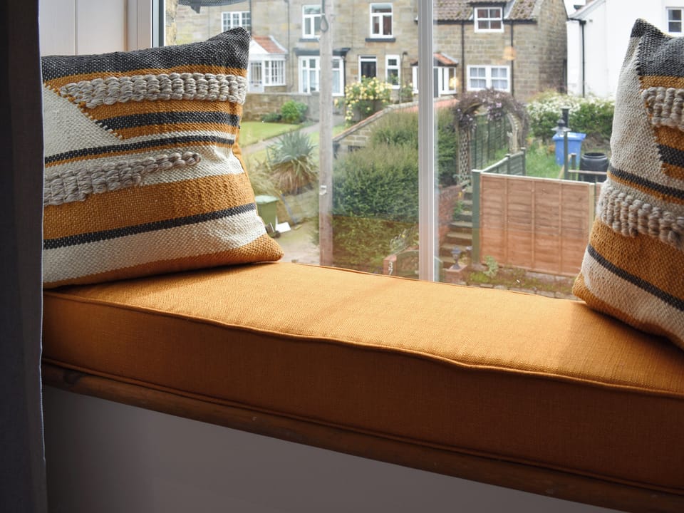 Window seat within double bedroom | Elizabeth Cottage, Hinderwell, near Whitby 