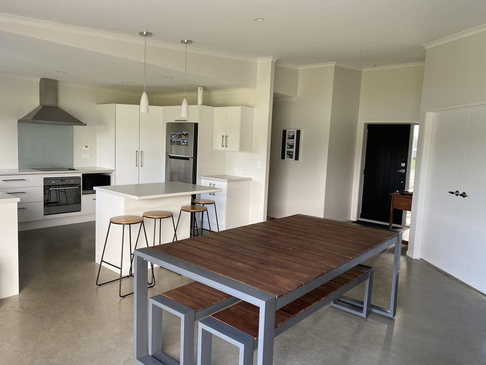 Dining area with indoor/outdoor dining table.