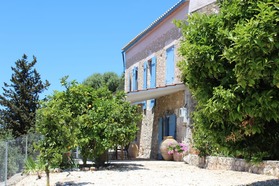 The front terrace is framed by citrus, olive trees and beautiful antique urns.