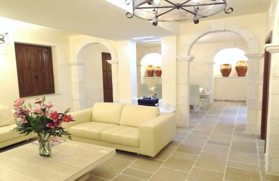 Luxurious 30-foot living area with beautiful stone arches and floors