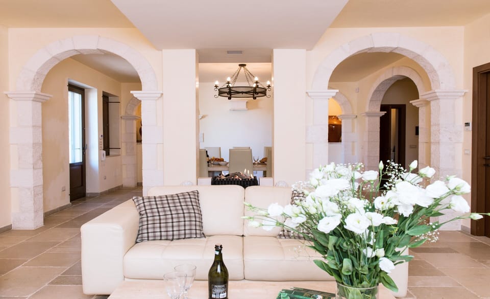 Spacious and stylish open plan living area with luxurious italian leather sofas