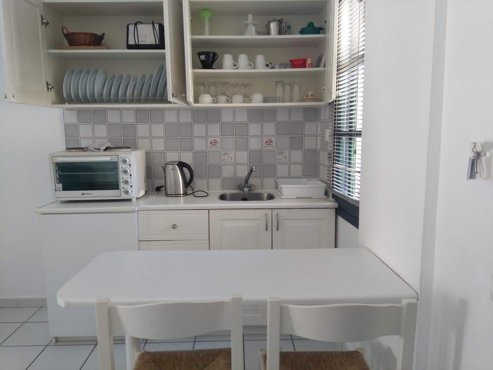 Kitchen  (There is a Free washing machine facility on the premises)