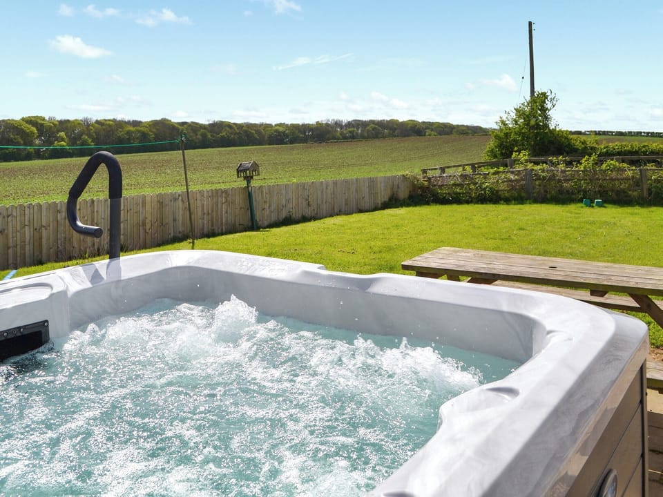 Luxurious hot tub on the patio | Granary Cottage - Metlands Farm Holidays, Bempton, near Bridlington