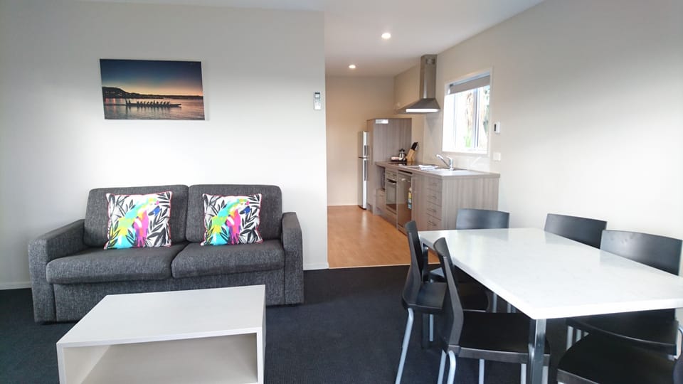 Two Bedroom Lodge | Living area | 30-inch TV with satellite channels