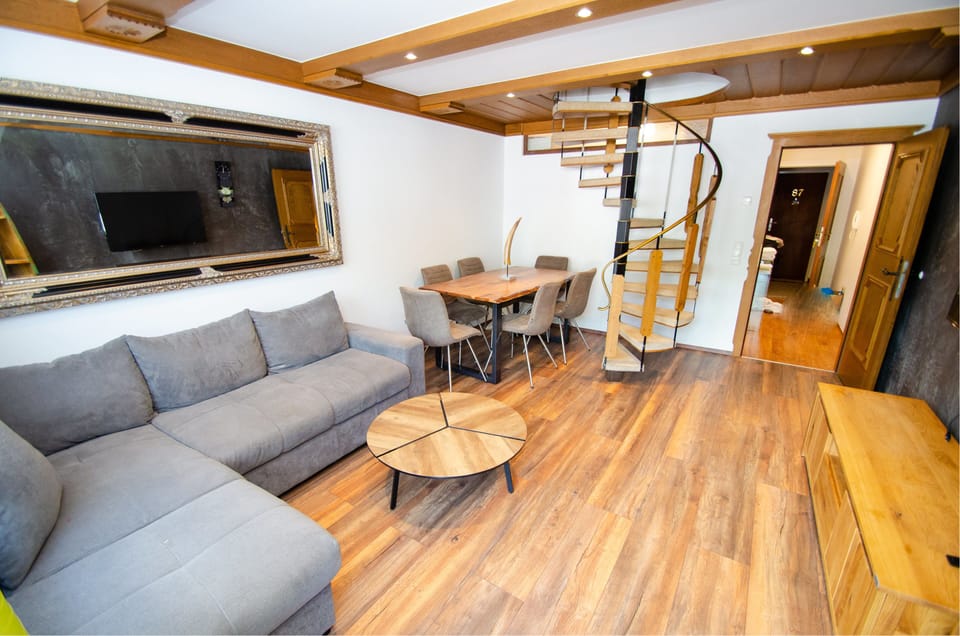 Penthouse 81 Kaprun | Living area | Flat-screen TV