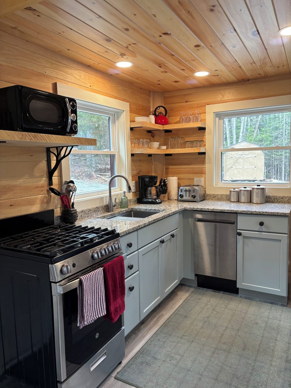 Full kitchen with gas stove, dishwasher, and fridge.  