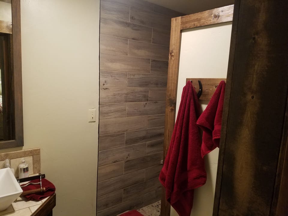 Entrance into tile shower.
