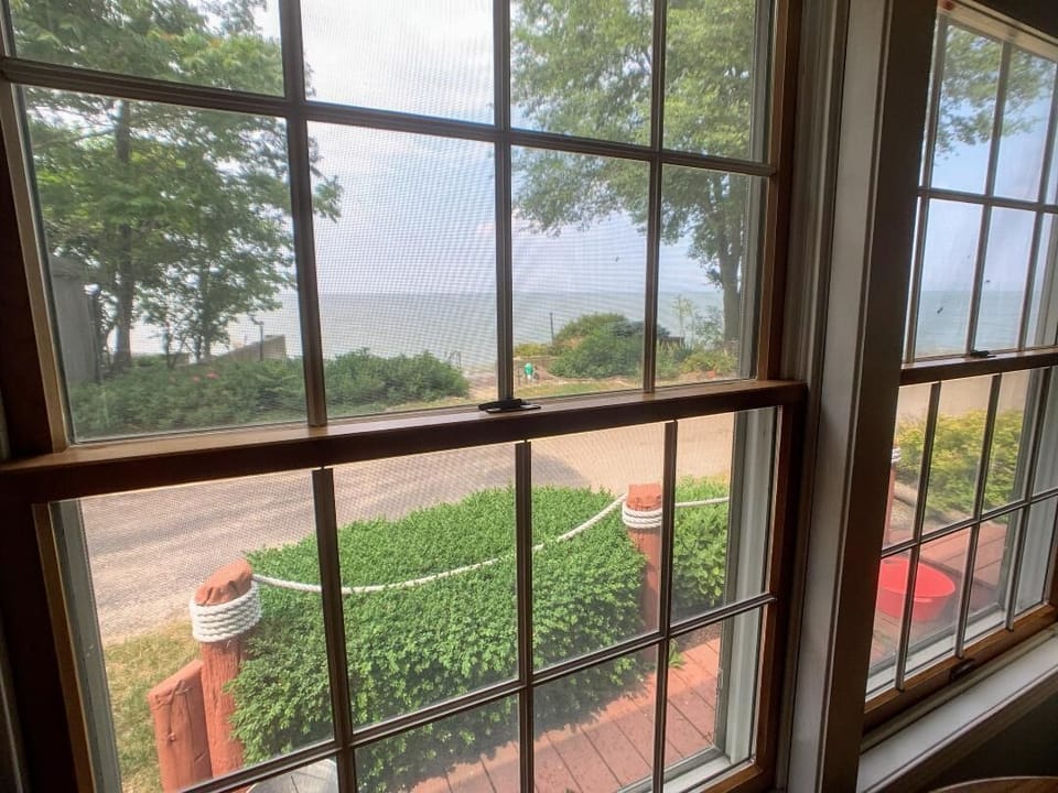 View of our private walled beach and Lake Erie from front room dining table.