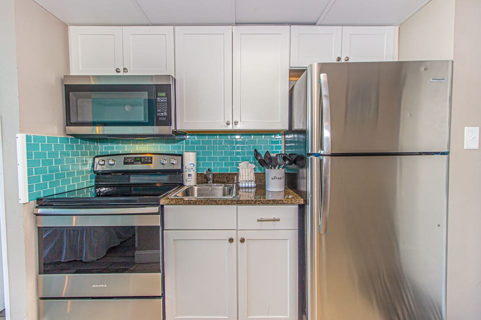 Full microwave, oven/range and refrigerator.