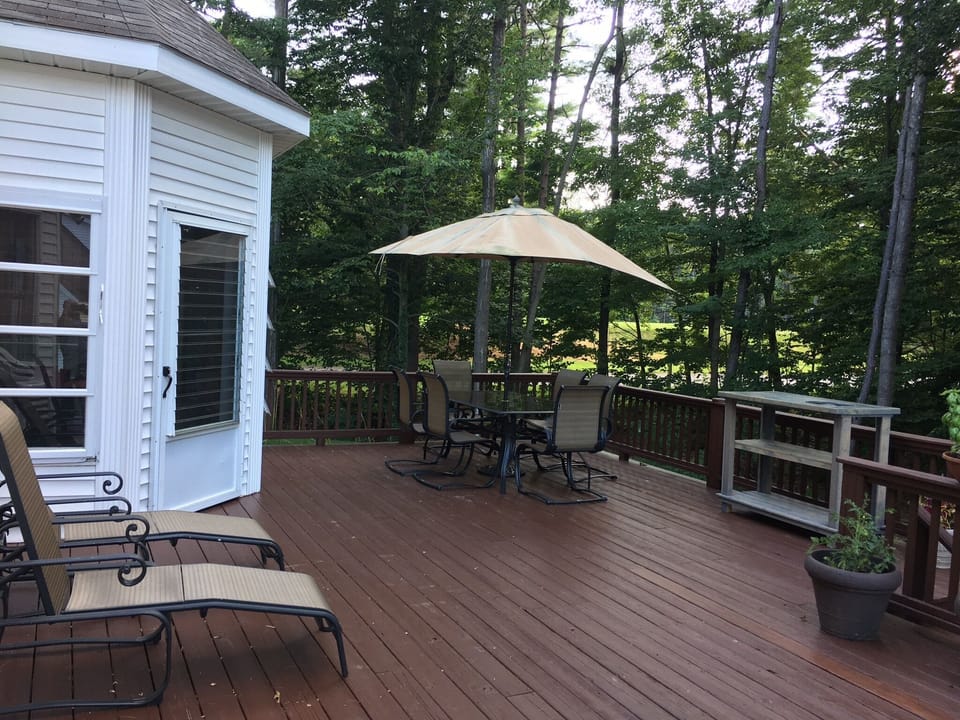 Deck with Table, Chairs, 2 Chaise Lounges and Grill