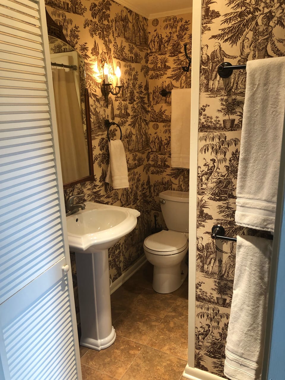 Small efficient bath. Shower only. Hair dryer/ shampoo/cond/body wash provided. 