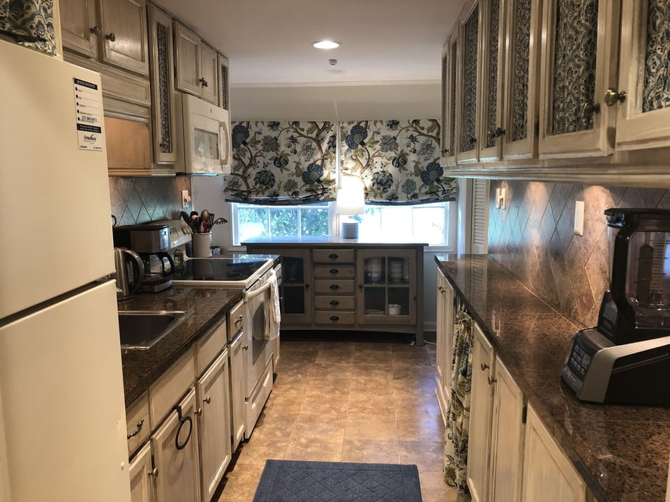 Galley Kitchen. Equipped with all essentials.  No Dishwasher. 