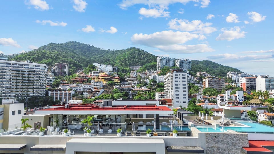 Impressive view of the rooftop with backdrop mountains