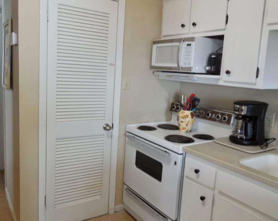 The pantry has plenty of shelf space, plus cleaning supplies
