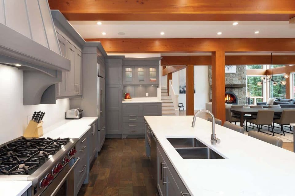 - Modern kitchen with premium appliances and sleek gray cabinetry  
- Large island perfect for preparing meals or casual seating  
- Designed for home chefs with style and functionality in mind  
