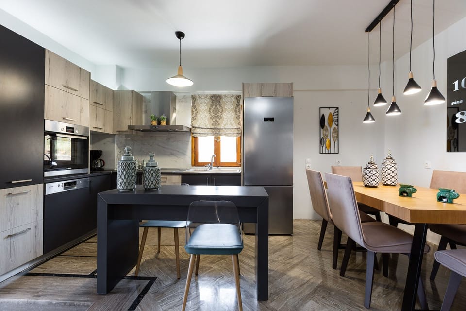 Indoor dining area and breakfast counter by the kitchen.