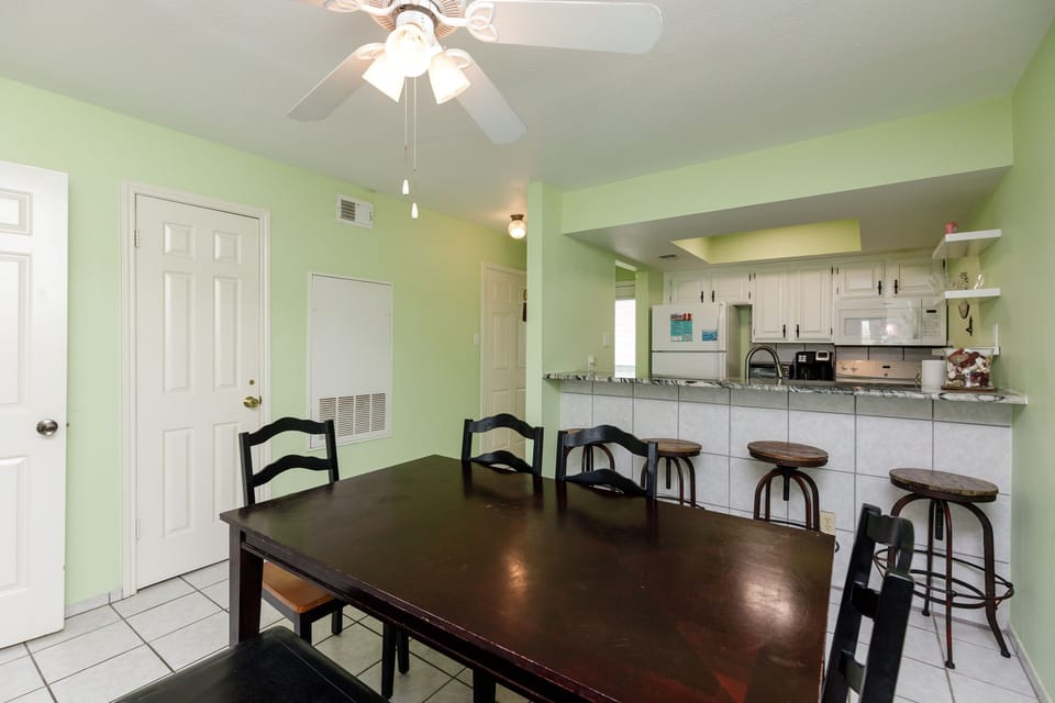Gather around your spacious dining table while meals are prepared in the bright, open kitchen - perfect for group conversations and shared moments.