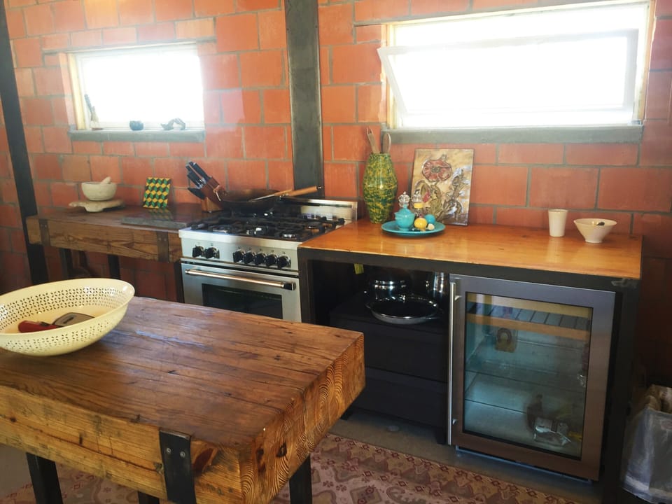 Gas range and electric oven and under counter refrigerator