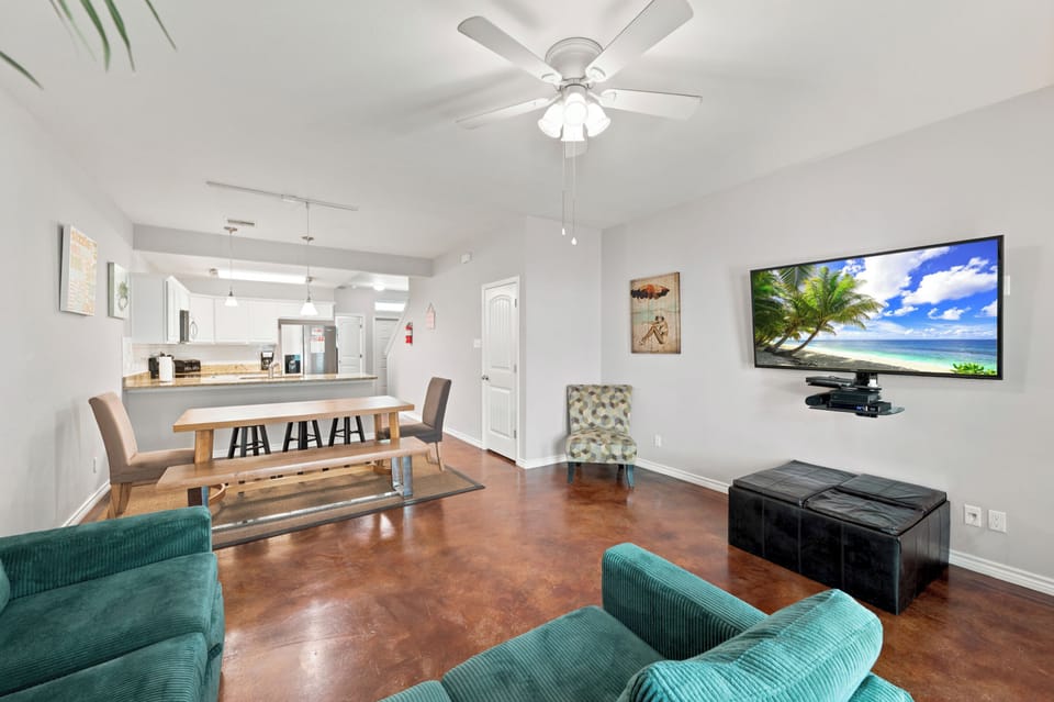 Settle into your bright living space with comfortable seating and open flow to the kitchen—perfect for gathering with your group.