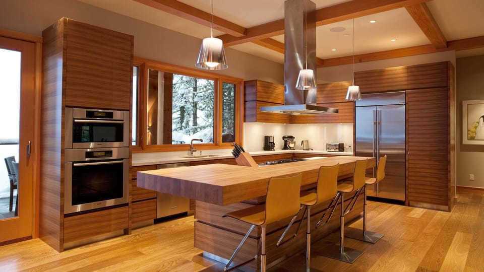 - Modern kitchen with wood finishes and high-end appliances for easy dining  
- Spacious island seating designed for morning coffee or shared meals  
- Cook and connect in a stylish alpine-inspired culinary space  
