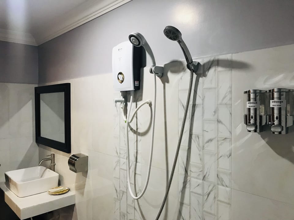 Shower, free toiletries, slippers, towels