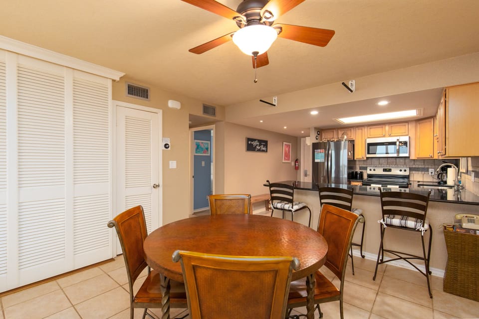 Your spacious dining area flows seamlessly into a fully equipped kitchen, perfect for sharing meals and creating memories with loved ones.