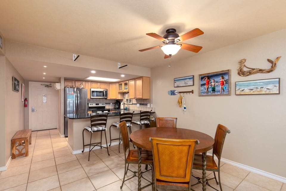 Gather around your spacious dining area with coastal charm, where the open kitchen design creates perfect flow for meal prep and conversation.