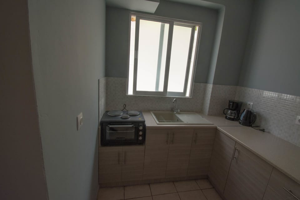 Apartment | Private kitchen | Fridge, stovetop, electric kettle, cookware/dishes/utensils