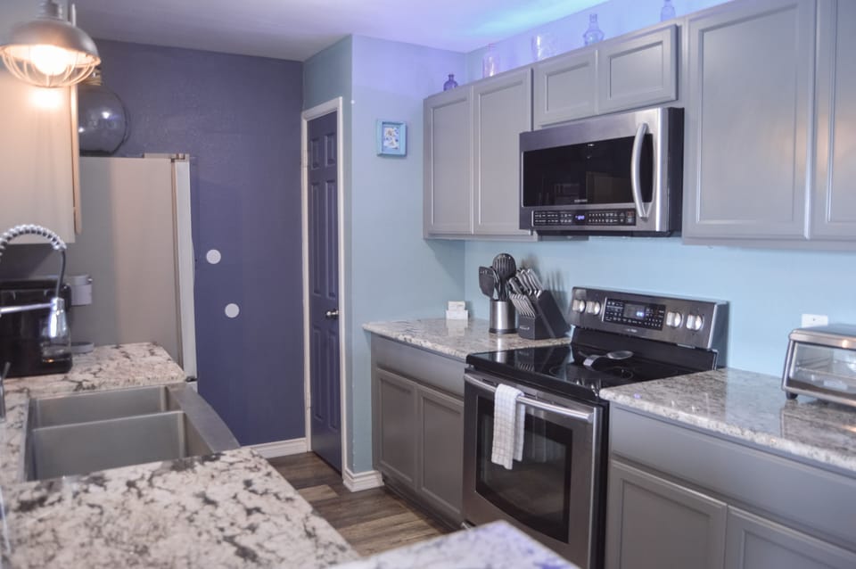 Your modern kitchen awaits with granite counters, stainless appliances, and everything you need to create memorable meals during your stay.